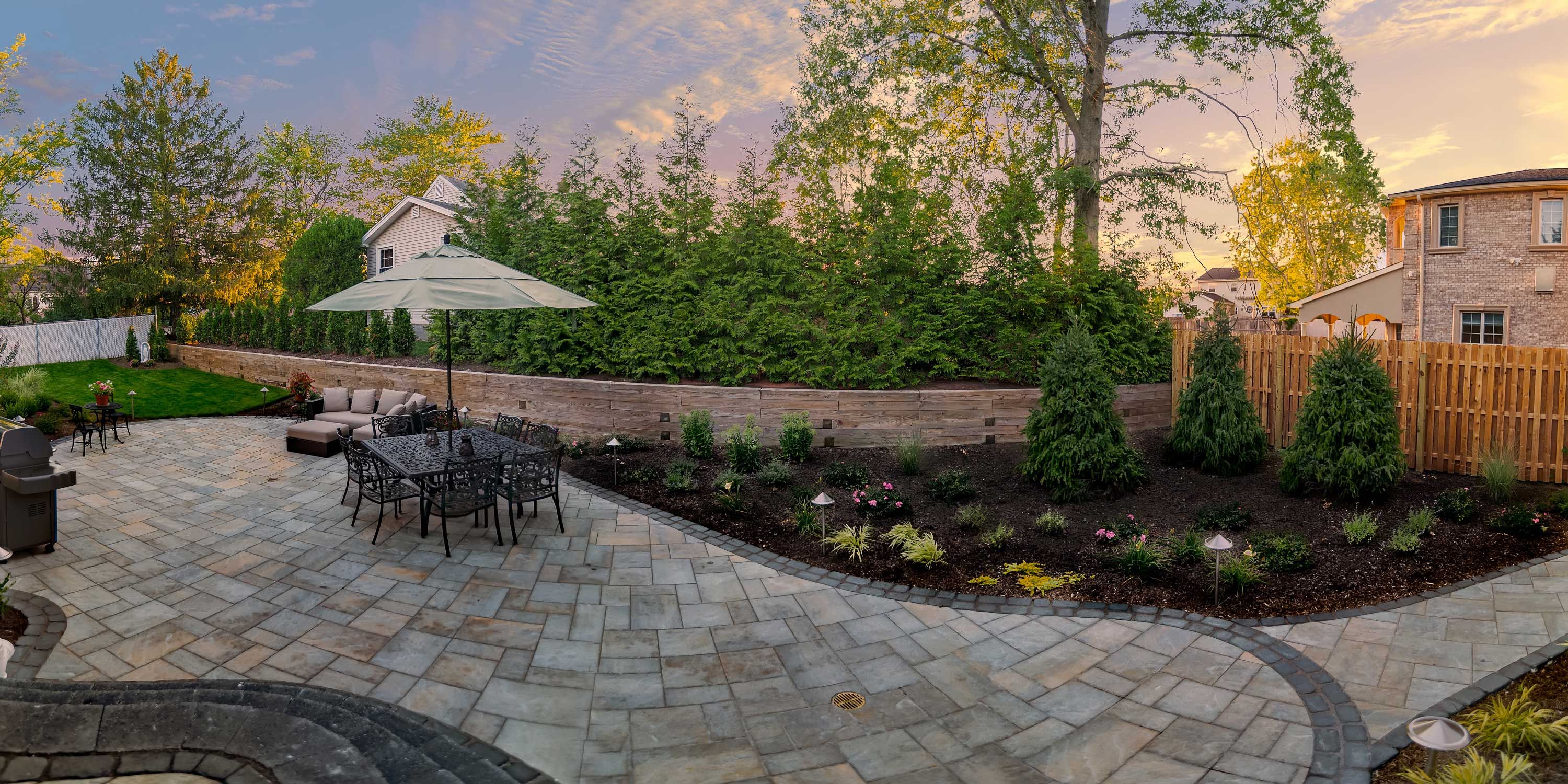 sonance lighting and audio in a backyard with stone patios